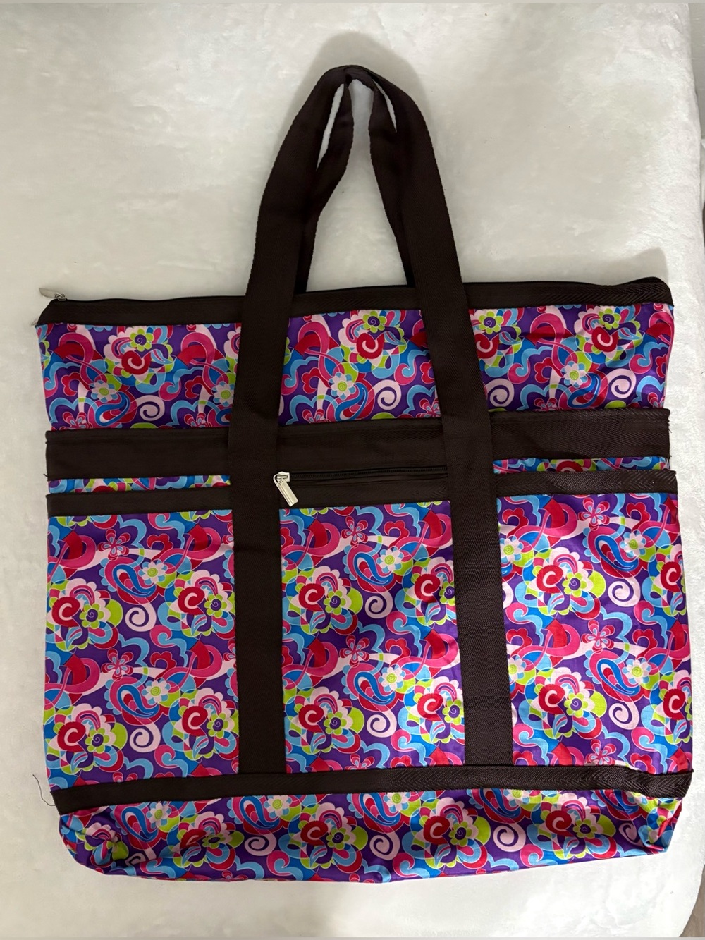 Braciano multi-pocket travel utility tote bag.Brown/ pink muti- pickets on front